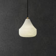 Alabaster Hat Pendant Light Over Nightstand - thebelacan